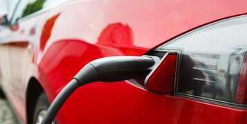 The,Car,Being,Charged,On,A,Street