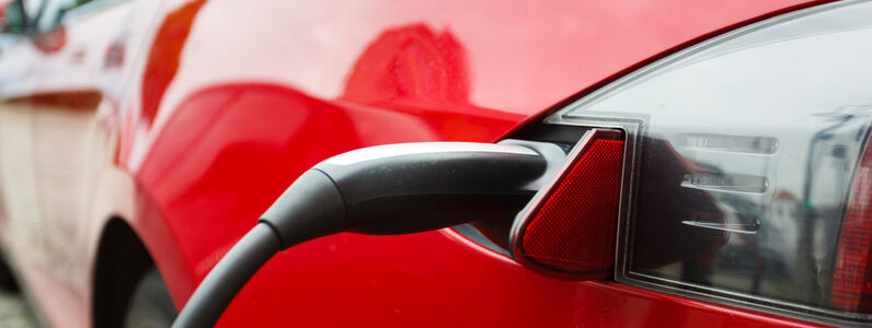 The,Car,Being,Charged,On,A,Street